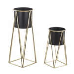 Two plant stands with geometric gold-colored frame and black pots